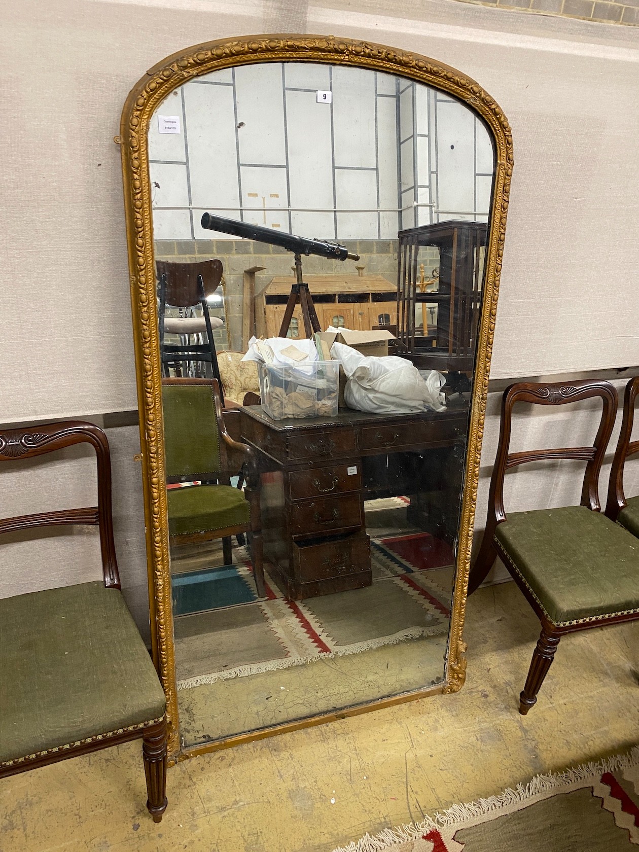 A Victorian giltwood and composition overmantel mirror, width 90cm, height 174cm (re-gilded)